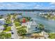Inviting waterfront home boasting a private dock, and lush surroundings, enhanced by stunning water views at 11240 6Th E St, Treasure Island, FL 33706