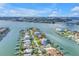 Waterfront home on the canal, featuring lush landscaping, private docks, and scenic water views at 11240 6Th E St, Treasure Island, FL 33706
