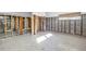 Basement featuring open layout, cinder block walls, and terrazzo flooring at 11240 6Th E St, Treasure Island, FL 33706