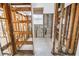 Bathroom renovation in progress, showing exposed framing and original concrete block construction at 11240 6Th E St, Treasure Island, FL 33706