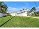 Charming one-story home with a well-maintained lawn, driveway, and garage, showcasing curb appeal at 11240 6Th E St, Treasure Island, FL 33706