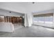 Living room featuring large windows and an open floor plan in need of repair at 11240 6Th E St, Treasure Island, FL 33706