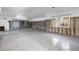 Vast living space with terrazzo floors, fireplace and a sliding glass door ready for renovation and personalization at 11240 6Th E St, Treasure Island, FL 33706