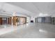 Large living room showing terrazzo floors, ceiling detail and renovation work underway, ready for customization at 11240 6Th E St, Treasure Island, FL 33706