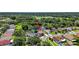 Stunning aerial view of home on a large lot with lush greenery and lake access at 11550 Wellman Dr, Riverview, FL 33578