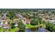 Residential home with lake and mature trees surrounding the property at 11550 Wellman Dr, Riverview, FL 33578