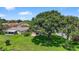 Private backyard with mature trees and lush lawn at 11550 Wellman Dr, Riverview, FL 33578