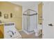 Bright bathroom featuring a glass enclosed shower, a garden tub and a toilet at 11550 Wellman Dr, Riverview, FL 33578