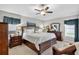 Comfortable bedroom with a ceiling fan, warm colors, and neutral carpeting offers relaxation and rest at 11550 Wellman Dr, Riverview, FL 33578