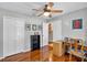 Bright and airy bedroom with hardwood floors and a ceiling fan at 11550 Wellman Dr, Riverview, FL 33578
