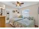 Cozy bedroom featuring two twin beds, neutral walls, and a ceiling fan at 11550 Wellman Dr, Riverview, FL 33578