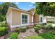 Close-up of home's exterior showcases window, manicured landscaping and exterior paint at 11550 Wellman Dr, Riverview, FL 33578