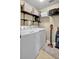 Laundry room featuring a washer, dryer, shelving and cleaning supplies at 11550 Wellman Dr, Riverview, FL 33578