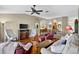 Spacious open concept living room with hardwood floors, natural light, and comfortable seating at 11550 Wellman Dr, Riverview, FL 33578