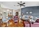 Spacious open concept living room with hardwood floors, natural light, and comfortable seating at 11550 Wellman Dr, Riverview, FL 33578