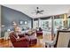 Bright living room with hardwood floors, high ceilings, and large windows, perfect for entertaining at 11550 Wellman Dr, Riverview, FL 33578