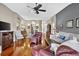 Spacious open concept living room with hardwood floors, natural light, and comfortable seating at 11550 Wellman Dr, Riverview, FL 33578