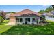 Bright sunroom with large windows, ideal for relaxation and enjoying natural light at 11550 Wellman Dr, Riverview, FL 33578