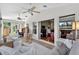 Open sunroom featuring a seating area with a view to the living room at 11550 Wellman Dr, Riverview, FL 33578