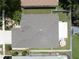 Aerial view of the home's roof, backyard with screened patio, gazebo, and fenced yard at 11610 Grove Arcade Dr, Riverview, FL 33569