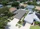 Aerial view of a well-maintained home featuring lush landscaping and a spacious driveway at 11610 Grove Arcade Dr, Riverview, FL 33569