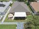 Aerial view of backyard with gazebo, covered patio, and well-maintained landscaping at 11610 Grove Arcade Dr, Riverview, FL 33569