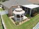 Aerial view of backyard with white gazebo covering a hot tub and screened-in patio at 11610 Grove Arcade Dr, Riverview, FL 33569