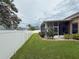 Manicured backyard with a well-maintained lawn, privacy fence, and tidy landscaping at 11610 Grove Arcade Dr, Riverview, FL 33569