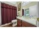 This is a bathroom with a toilet, vanity, sink, and shower with matching towels at 11610 Grove Arcade Dr, Riverview, FL 33569