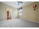 Inviting bedroom with neutral walls, soft carpeting, and a fun ceiling fan, creating a comfortable space at 11610 Grove Arcade Dr, Riverview, FL 33569