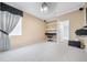 Spacious bedroom with built-in shelving, neutral decor, and plush carpeting, offering a serene living space at 11610 Grove Arcade Dr, Riverview, FL 33569