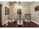 Elegant dining room featuring a glass-top table and decorative chairs at 11610 Grove Arcade Dr, Riverview, FL 33569