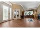 Foyer showcasing wood-look flooring, a decorative glass front door, and natural light at 11610 Grove Arcade Dr, Riverview, FL 33569