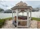 Backyard gazebo with an enclosed hot tub and lattice support beams at 11610 Grove Arcade Dr, Riverview, FL 33569