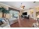 Spacious living room with a large television and a sliding glass door at 11610 Grove Arcade Dr, Riverview, FL 33569