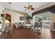 Comfortable living room with hardwood floors, a sectional sofa, and a glass coffee table at 11610 Grove Arcade Dr, Riverview, FL 33569