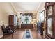 Cozy living room features hardwood floors and a decorative fire place at 11610 Grove Arcade Dr, Riverview, FL 33569