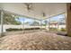 Expansive screened-in patio with brick flooring, ceiling fans, and views of the backyard at 11610 Grove Arcade Dr, Riverview, FL 33569