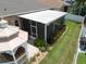 Aerial view of screened patio and gazebo in fenced backyard featuring manicured landscaping at 11610 Grove Arcade Dr, Riverview, FL 33569