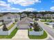 Aerial view of a well-maintained home with a fenced backyard and an attached two-car garage at 13027 Pennybrook Dr, Riverview, FL 33579