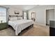 Bright bedroom showcasing a cozy bed, soft carpeting, and ample natural light from the windows at 13027 Pennybrook Dr, Riverview, FL 33579