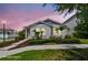 Charming single-story home with well-manicured landscaping, stone walkway, and inviting curb appeal at 13027 Pennybrook Dr, Riverview, FL 33579