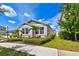 Well-maintained home with manicured lawn, tidy mulch beds, and a welcoming walkway to the front door at 13027 Pennybrook Dr, Riverview, FL 33579