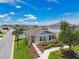 Charming one-story home with landscaped front yard and well-manicured garden, perfect for curb appeal at 13027 Pennybrook Dr, Riverview, FL 33579