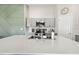 Bright kitchen showcasing a large island with a stainless steel sink, quartz countertops and contemporary cabinetry at 13027 Pennybrook Dr, Riverview, FL 33579