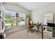 Inviting home office featuring ample natural light, a comfortable workspace, and a view of the outdoors at 13027 Pennybrook Dr, Riverview, FL 33579