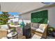 Inviting outdoor seating area featuring patio furniture and neutral awning, great for outdoor living at 13027 Pennybrook Dr, Riverview, FL 33579