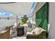 Inviting outdoor seating area featuring patio furniture and neutral awning, great for outdoor living at 13027 Pennybrook Dr, Riverview, FL 33579