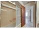 Bathroom featuring a shower and tile walls at 1309 Sandalwood Dr, Plant City, FL 33563