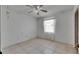 Bedroom featuring a window, ceiling fan, and tiled flooring at 1309 Sandalwood Dr, Plant City, FL 33563